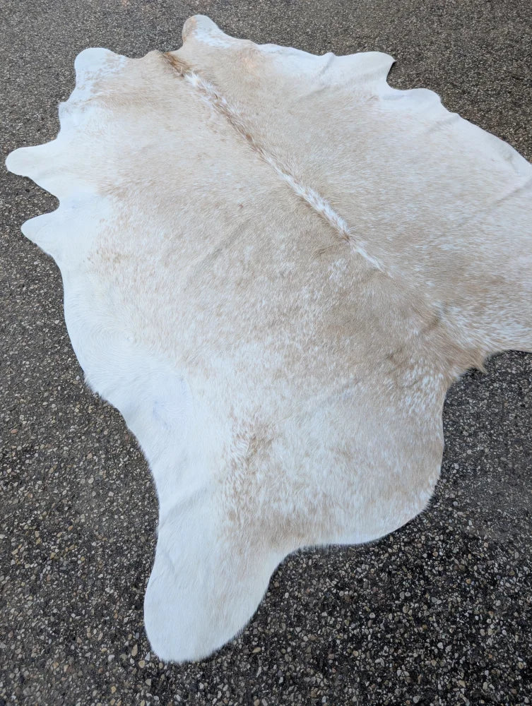 Large cowhide rug 92 x 81 with natural white and beige tones and soft textured surface offering rustic charm and unique characteristics