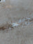 92 x 81 inch large cowhide rug in beige and white with natural fur texture showcasing rustic charm and unique characteristics