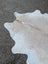 Large cowhide rug 92 x 81 in off white and beige with unique characteristics and rustic charm soft textured surface