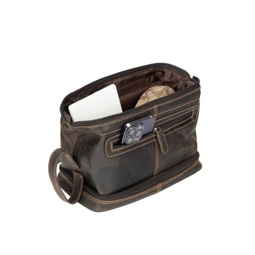 Napier leather toiletry bag in brown with tan stitching, sturdy zipper pocket holding phone