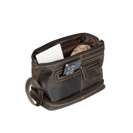 Napier leather toiletry bag in brown with tan stitching, sturdy zipper pocket holding phone