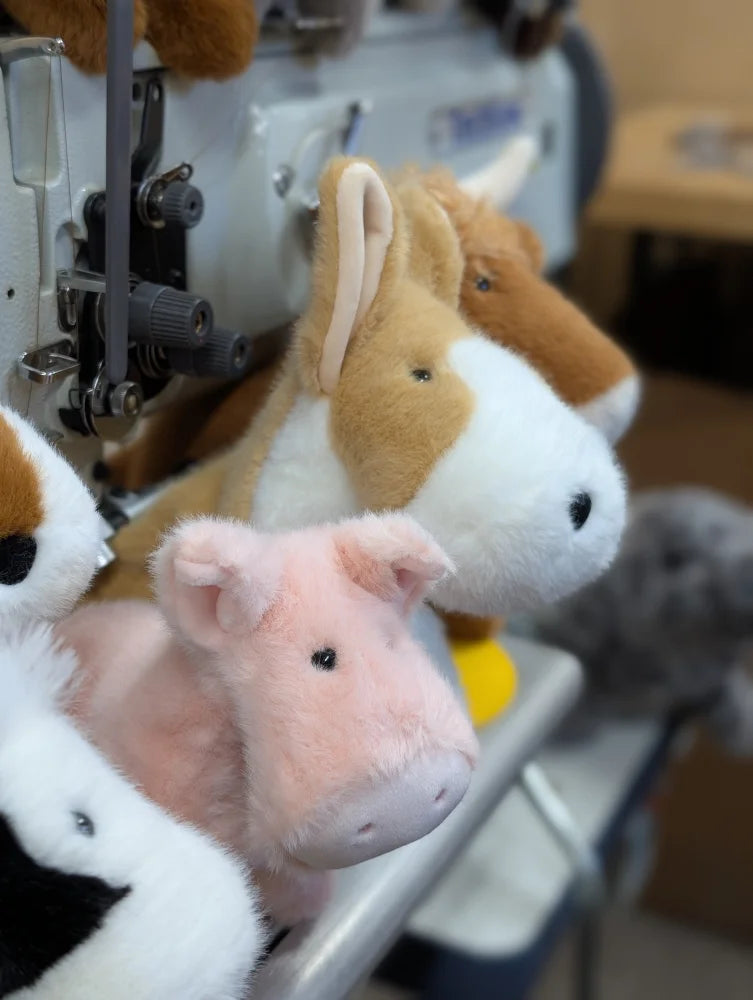 Adorable corgi plush pig in pink with black button eyes and soft fuzzy texture perfect for cuddling
