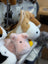 Adorable corgi plush pig in pink with black button eyes and soft fuzzy texture perfect for cuddling