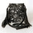 Black and white speckled genuine leather Chaps cowhide crossbody bag with fringe straps. Canada