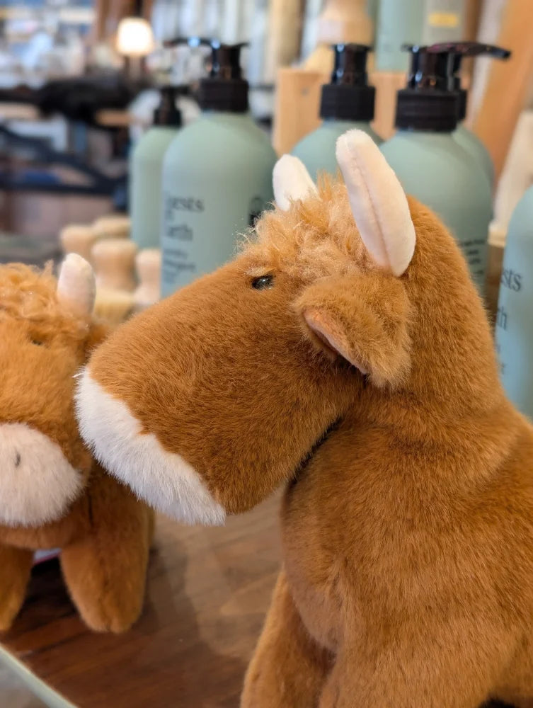 Adorable highland cow stuffed toy in tan with white muzzle and horns soft plush highland cow stuffed animal