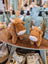 Two plush highland cow stuffed toys with brown fur and white snouts, adorable cow stuffed animals for cozy decor