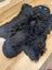 Adorable handmade black bear rug made of soft merino sheepskin perfect as a fluffy animal fur decor piece