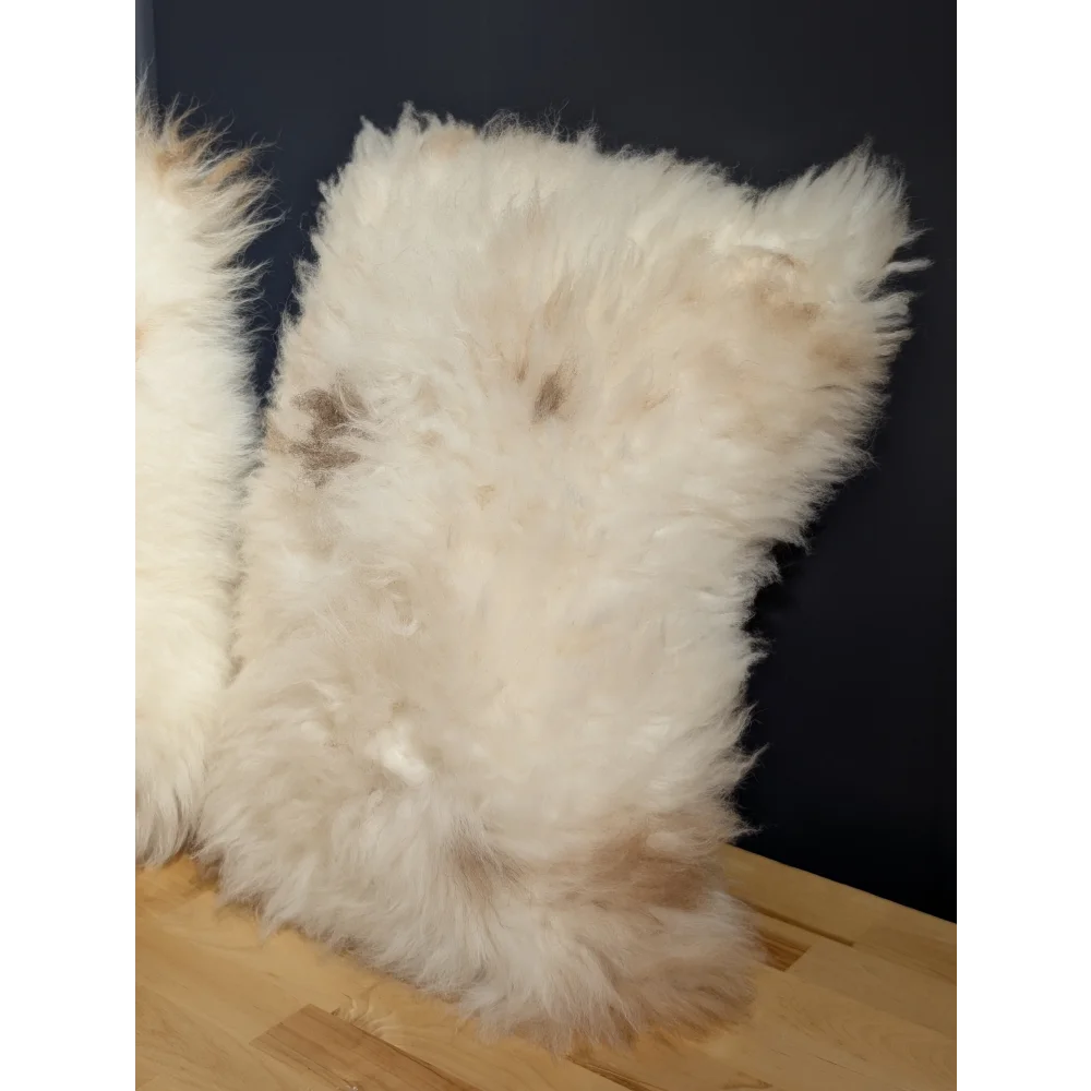 Fluffy off-white sheepskin pillow with soft voluminous fur from adorable set by angus oliver canada sheepskin rugs