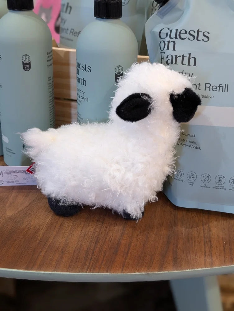Adorable shilo the mini sheep soft toy with fluffy white plush body and black ears and feet perfect for cuddling