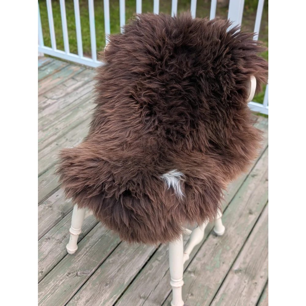 Rare British sheepskin throw blanket 43x26 with white trim and wooden legs