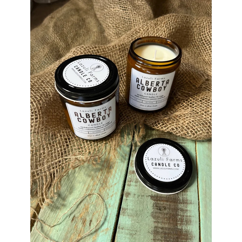 Alberta Cowboy Candle in amber glass jar with black lid