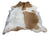 Brown and white large cowhide rug with natural fur texture showcasing unique characteristics beautiful rugs arriving soon