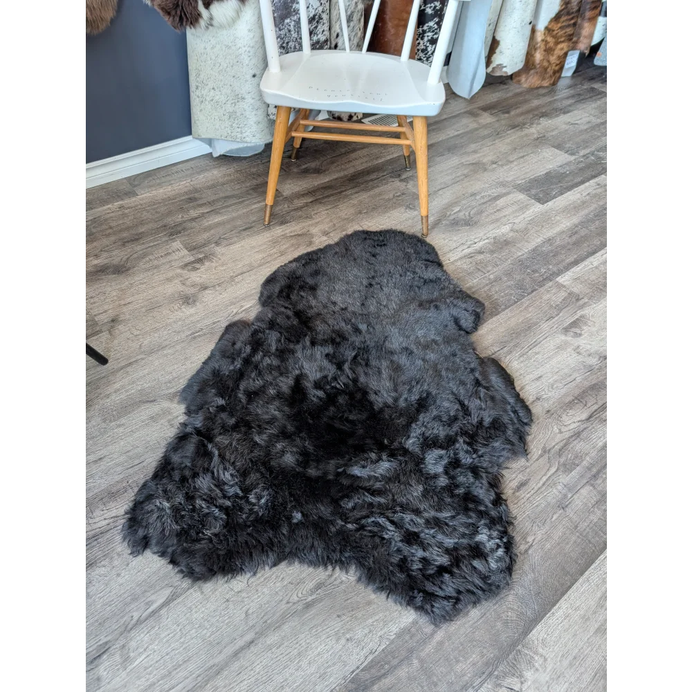 Soft Icelandic sheepskin rug, plush dark gray 47x33in natural shape