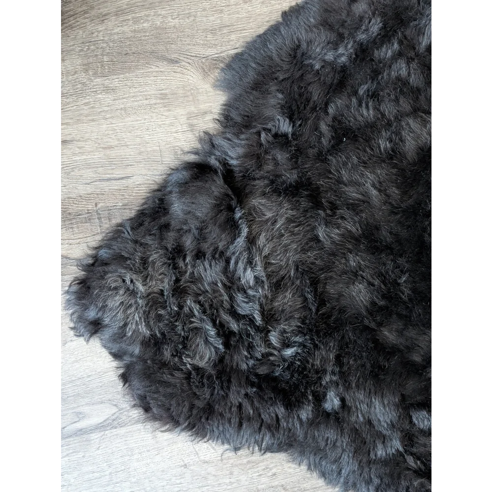 Soft Icelandic sheepskin rug 47x33in on wood floor