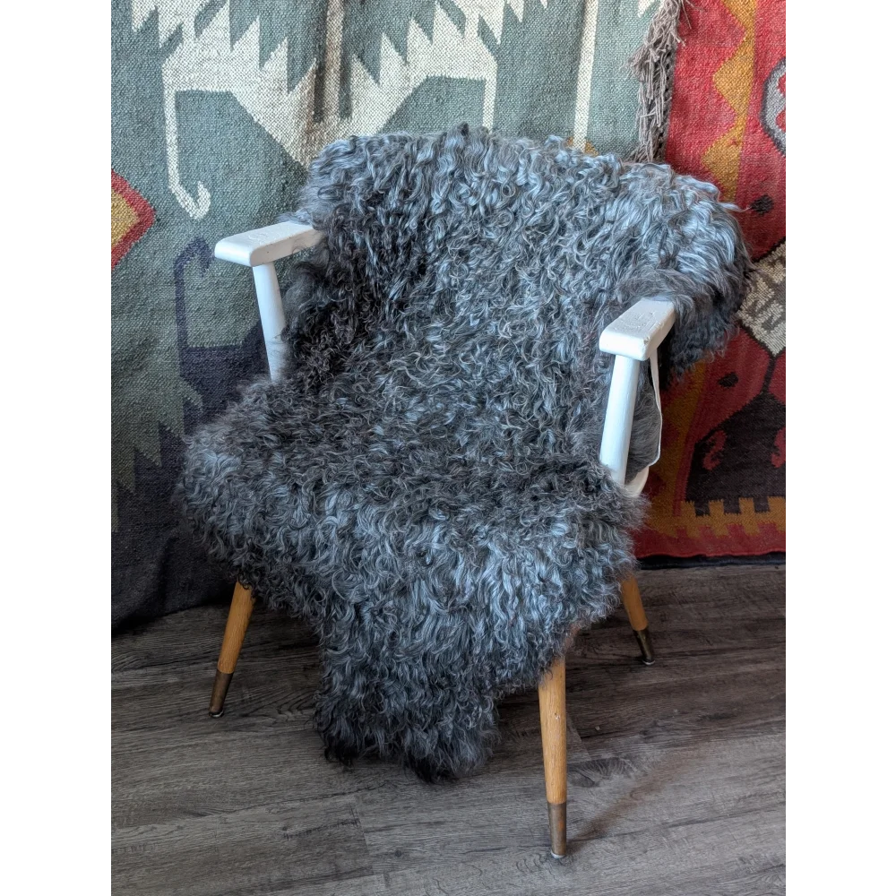 Plush Gotland sheepskin 52x31 rug on white wood chair