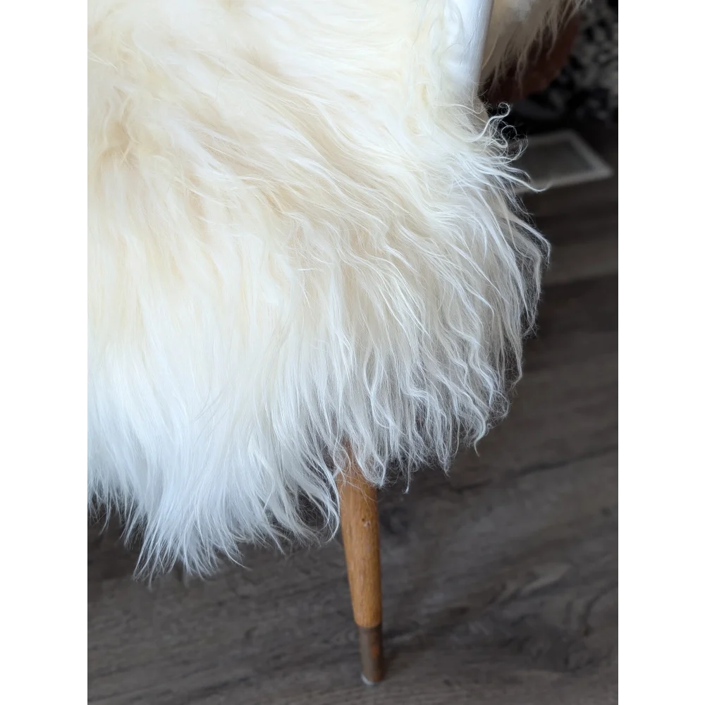 Plush white Icelandic sheepskin rug 50x34 inches with wooden legs