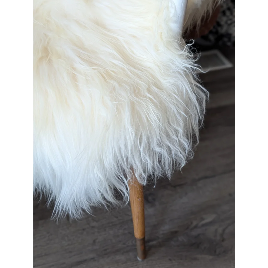 Plush white Icelandic sheepskin rug 50x34 inches with wooden legs