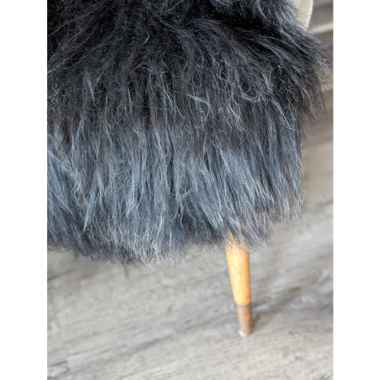 Soft Icelandic sheepskin rug stool with plush faux fur and wooden leg