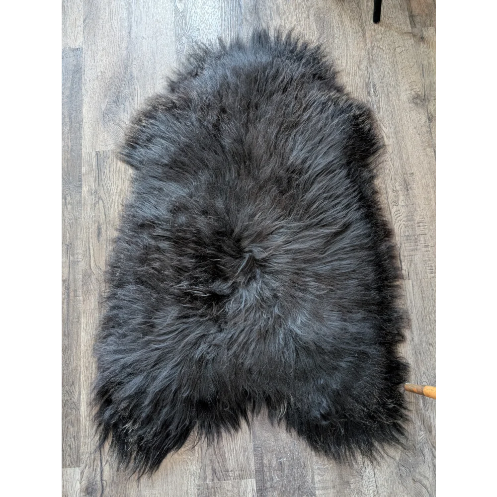 Soft Icelandic sheepskin rug AN52 49x32 inches on wood floor