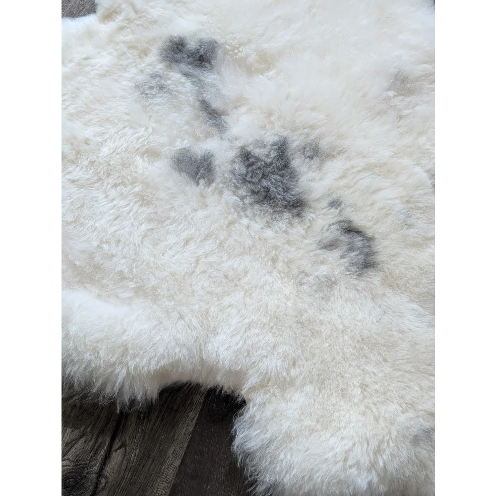 Soft Icelandic sheepskin rug 49x33in with gray patches fluffy texture