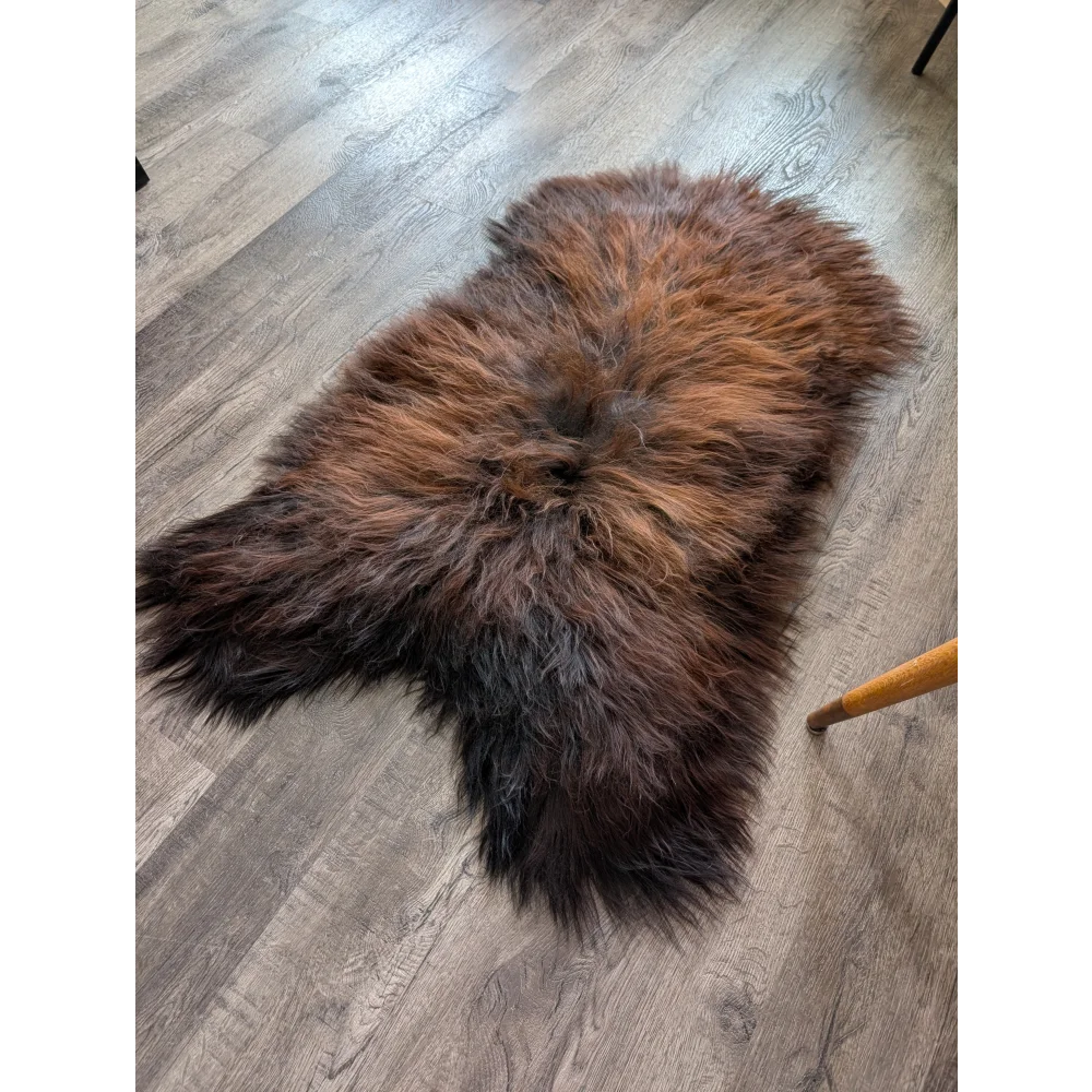 Soft Icelandic sheepskin rug AN55 49x28 inches on wood floor