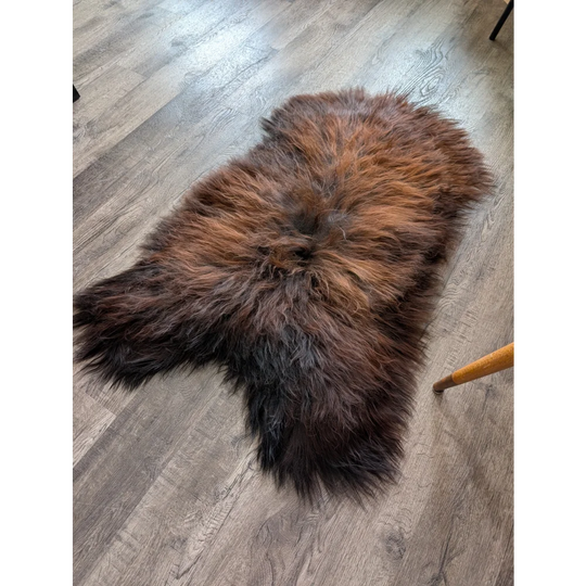 Soft Icelandic sheepskin rug AN55 49x28 inches on wood floor