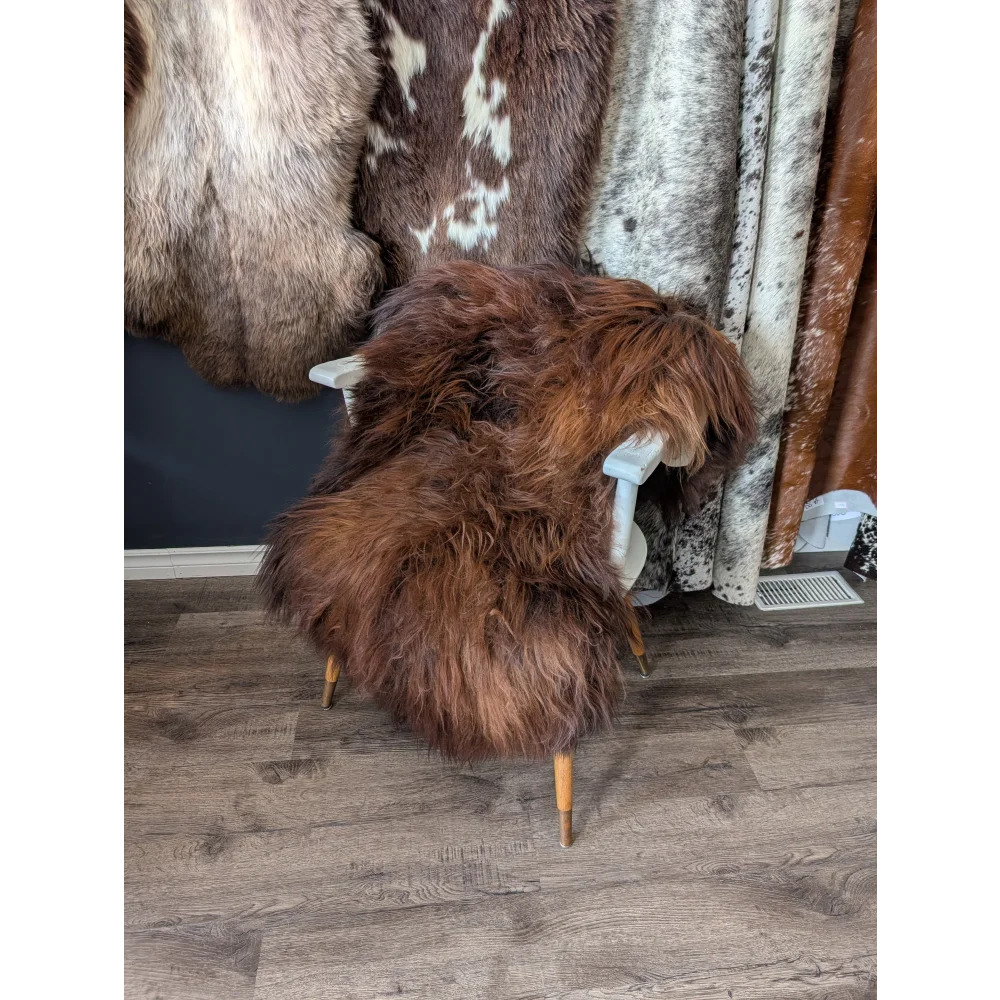 Soft Icelandic sheepskin rug AN58 on white wooden chair