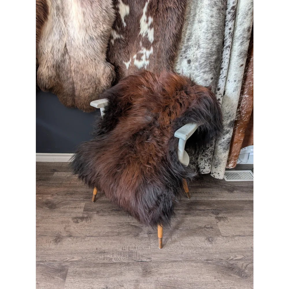 Soft Icelandic sheepskin rug 49x32 inches on gray chair