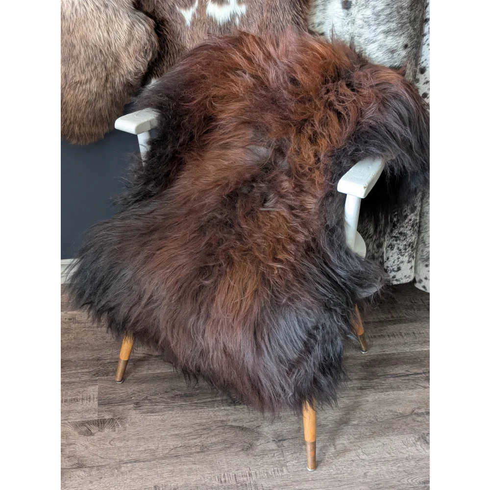 Soft Icelandic sheepskin rug AN59 on white wooden chair