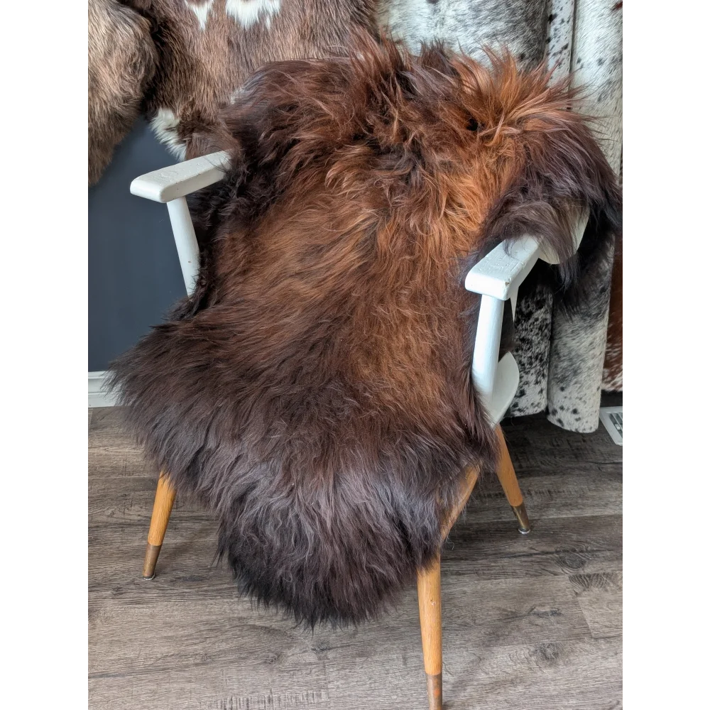 Thick soft Icelandic sheepskin rug on white chair, 49x29 inches