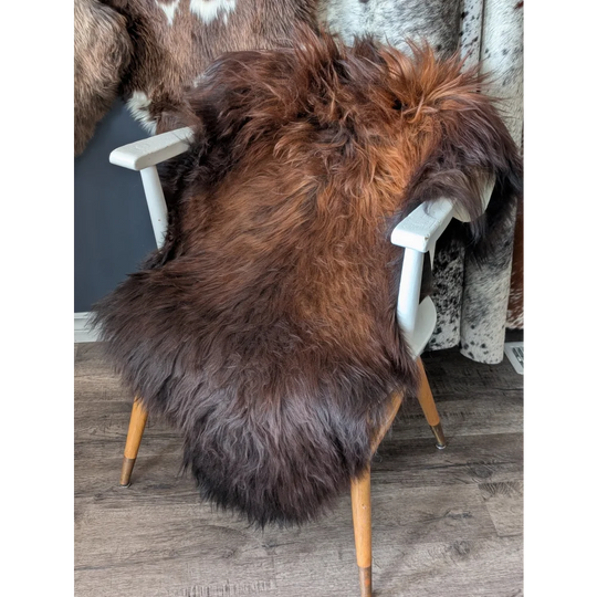 Thick soft Icelandic sheepskin rug on white chair, 49x29 inches