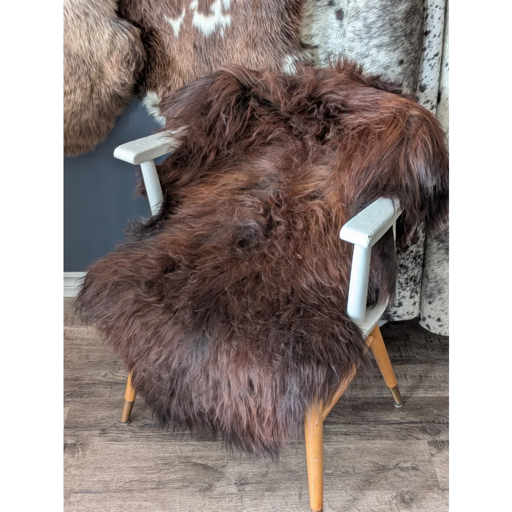 Soft Icelandic sheepskin rug on white wooden chair, 48x30 inches