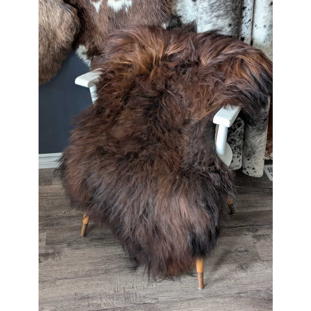 Soft Icelandic sheepskin rug 51x31 inches on white chair