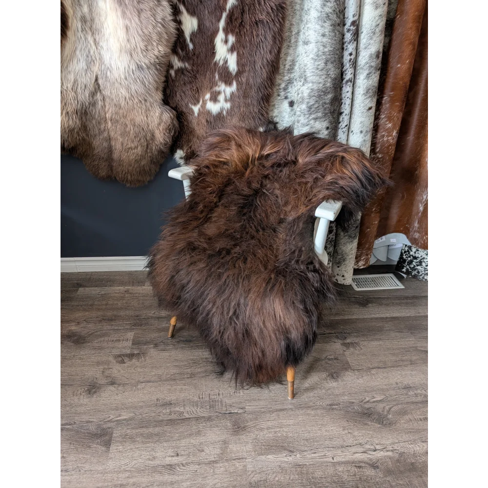 Soft Icelandic sheepskin rug 51x31 inches on white chair