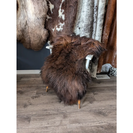 Soft Icelandic sheepskin rug 51x31 inches on white chair