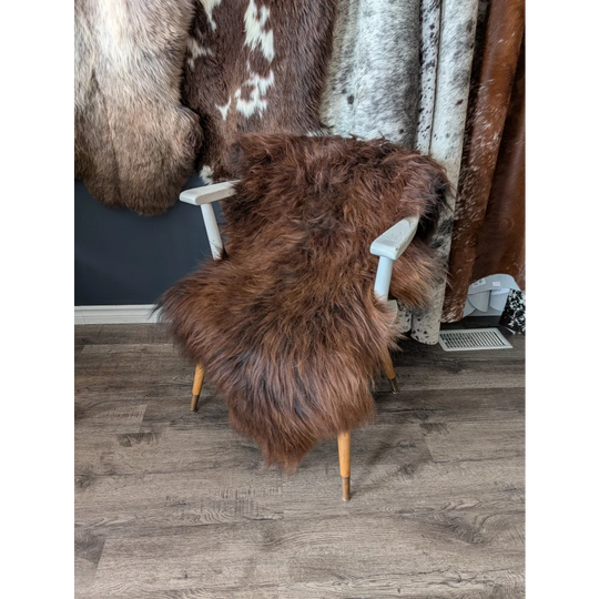 Soft Icelandic sheepskin rug on white wooden chair