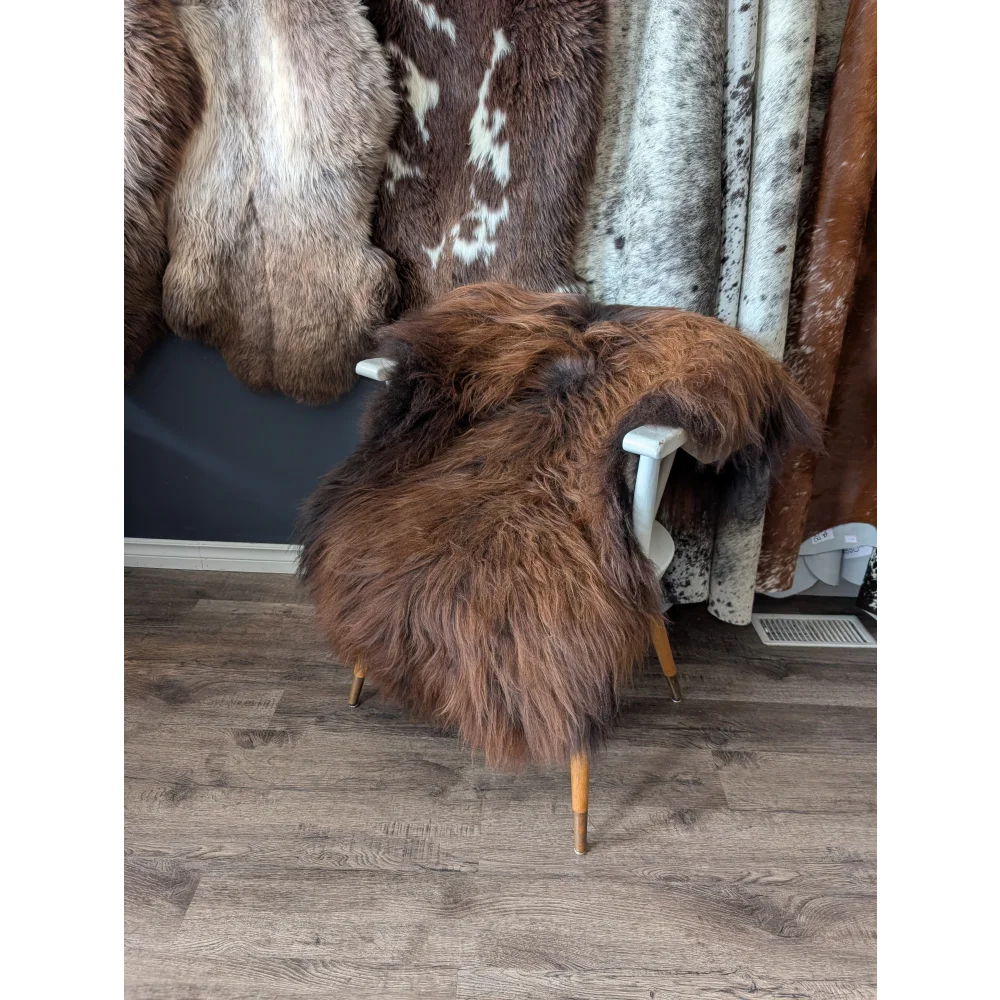 Soft Icelandic sheepskin rug 52x34 inches on white wooden chair