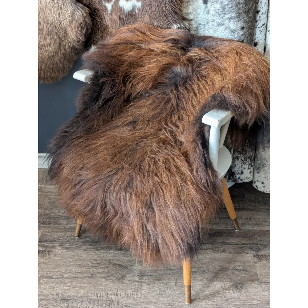 Soft Icelandic sheepskin rug 52x34 inches on white wooden chair