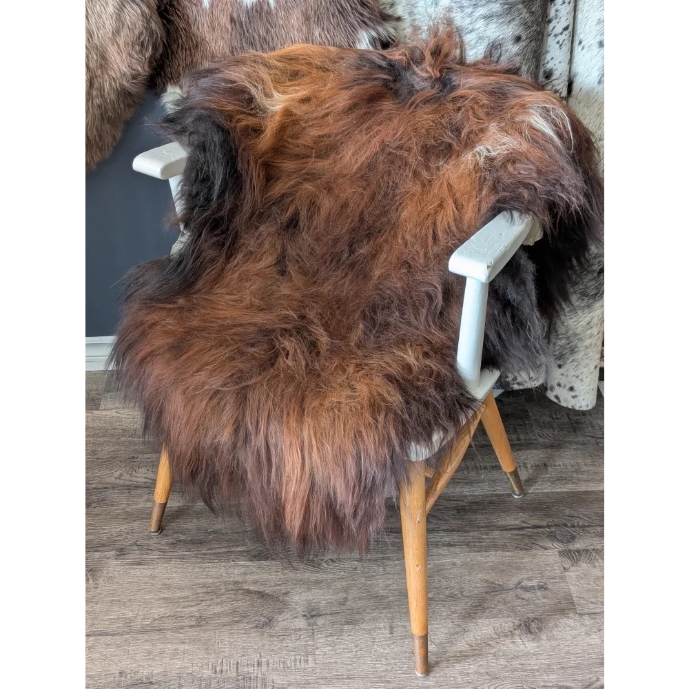 Soft Icelandic sheepskin rug 49x31 inches on white chair