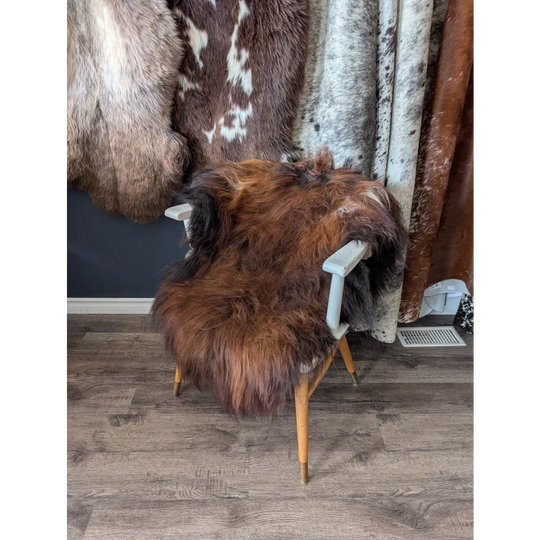 Soft Icelandic sheepskin rug 49x31 inches on white chair