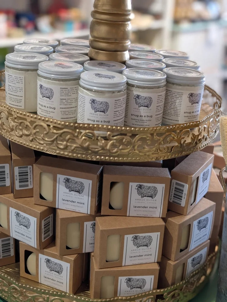 Angus Oliver lanolin soap bar with gold white sheep candle display