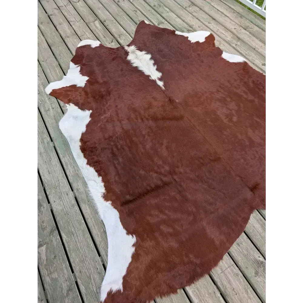 Large ASM#128 83’’ x 77’’ cowhide rug with brown and white patches, soft underfoot