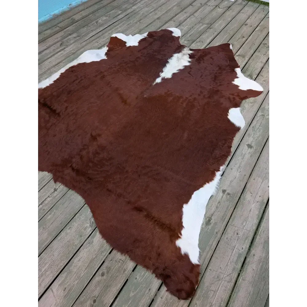 Large 83x77 cowhide rug with brown white patches, soft underfoot