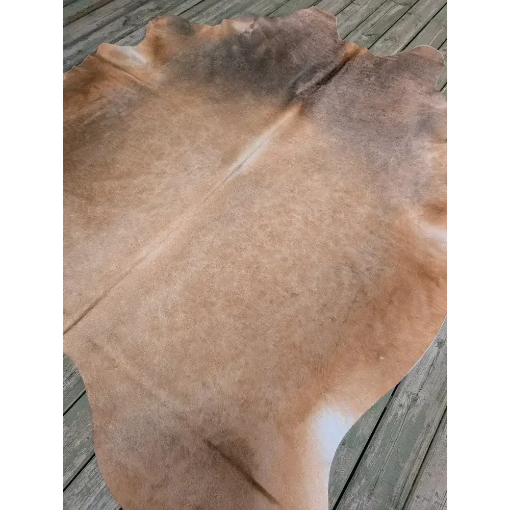 Fabulous extra large cowhide rug in vivid tan and brown hues