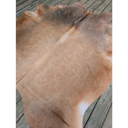 Fabulous extra large cowhide rug in vivid tan and brown hues