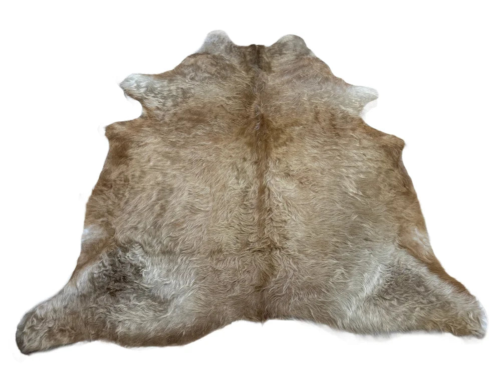 Natural brown and beige large cowhide rug with soft textured fur surface perfect for beautiful rugs collection