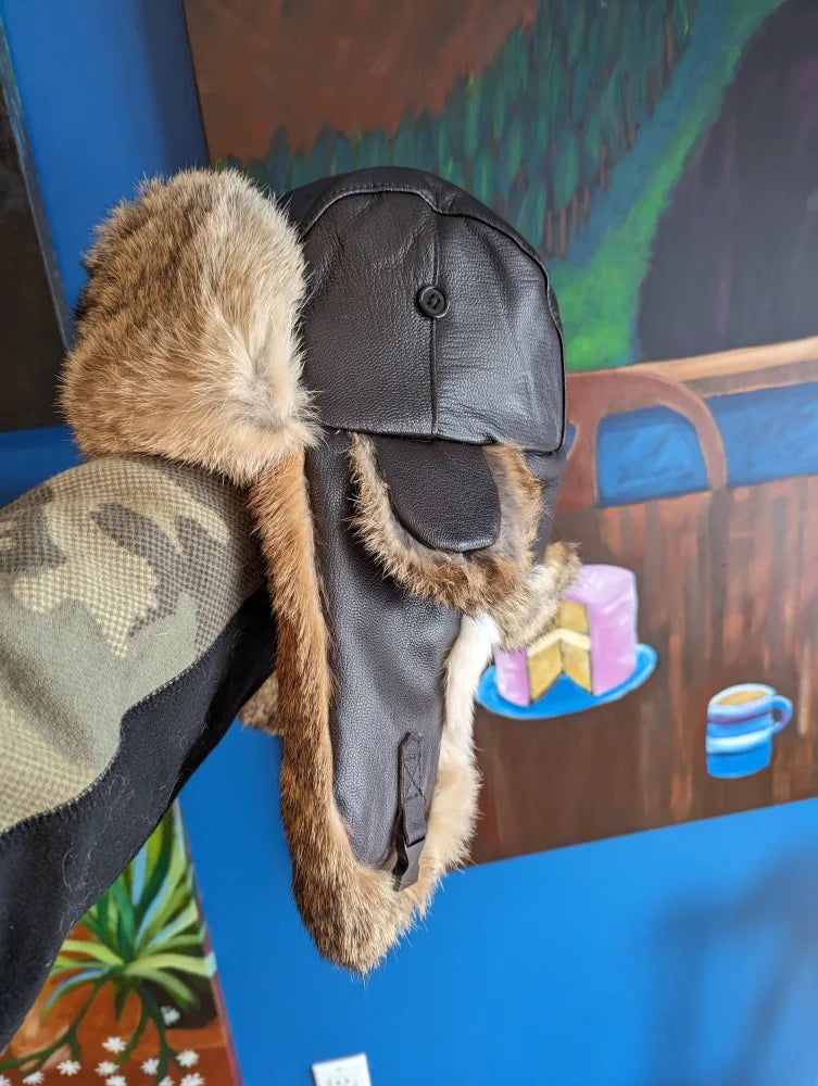 Black leather aviator hat made with rabbit fur trim and buttons