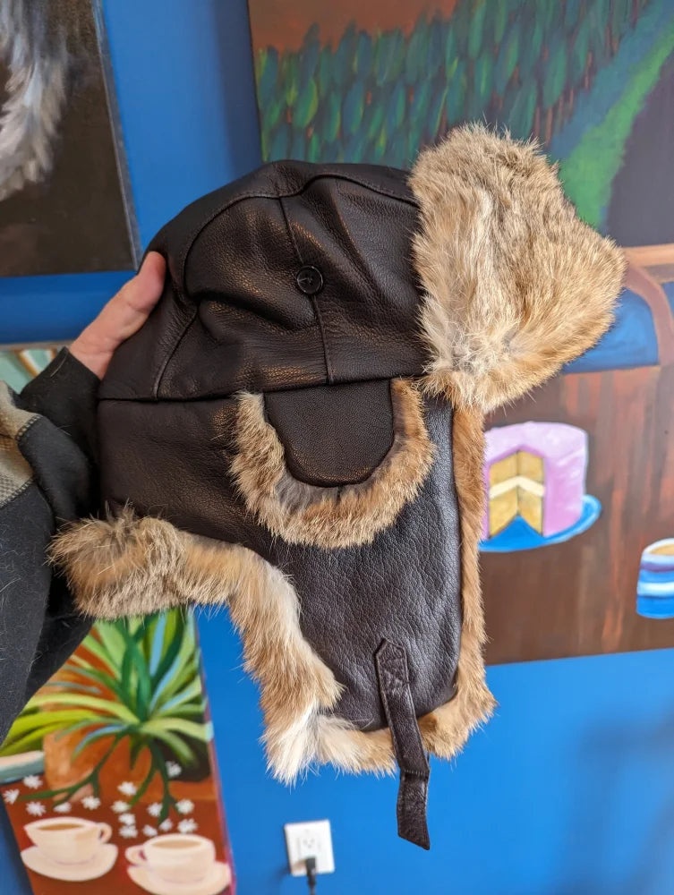 Brown aviator hat made with rabbit fur trim and leather ear flaps