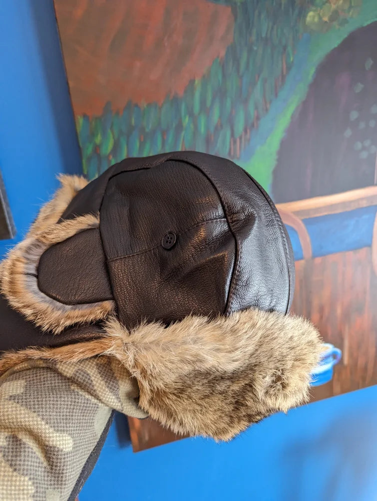 Brown leather aviator hat made with rabbit fur trim and ear flaps