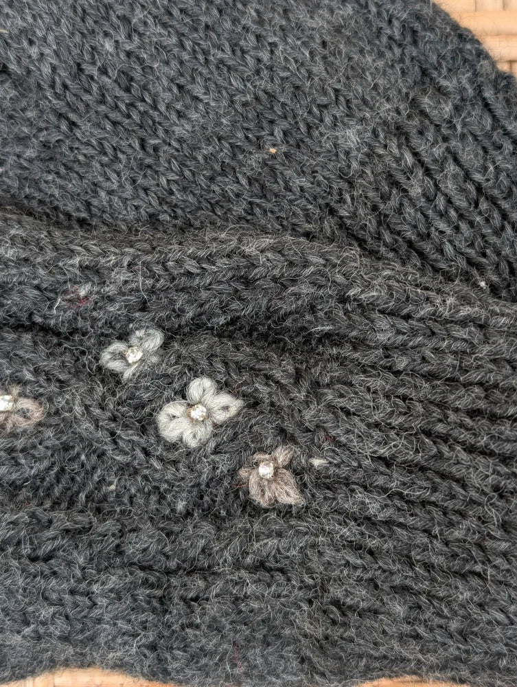Dark gray azalea mittens with floral embroidery and subtle white centers made from soft zealand wool